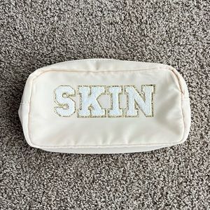 Cream Skin Pouch